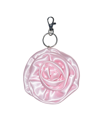 Pink rose-shaped keychain on a transparent background
